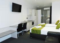 Single beds and desk in Family Studio Room